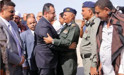  ??  ?? Yemen’s prime minister, Maeen Abdulmalik Saeed, is greeted by an army officer as he arrives at Aden airport on Monday. Photograph: EPA