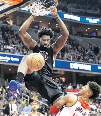  ?? Carolyn Kaster Associated Press ?? SHOT SELECTION like this fueled Clippers center DeAndre Jordan’s six-for-six night from the field. He had 15 points and 13 rebounds, and got no resistance from Kelly Oubre Jr. on this dunk.