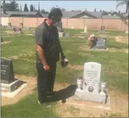  ?? RECORDER PHOTO BY CHARLES WHISNAND ?? Jay Rice stands at the grave site of Fransico Geronimo Villegas.