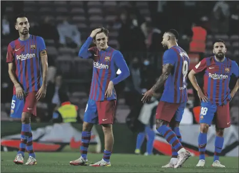  ?? AP PHOTO/JOAN MONFORT ?? Barcelona players react after the La Liga soccer match between Barcelona and Alaves at the Camp Nou stadium in Barcelona, Spain on Saturday. The match ended 1-1.