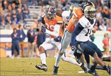  ?? Amber searls/usa Today sports ?? Virginia Cavaliers wide receiver Keytaon Thompson (99) carries the ball against the Georgia Tech Yellow Jackets during the fourth quarter at Scott Stadium.