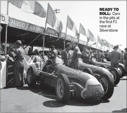  ??  ?? READY TO
ROLL: Cars in the pits at the first F1 race at Silverston­e