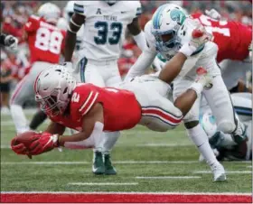  ?? JAY LAPRETE — ASSOCIATED PRESS ?? Ohio State running back J.K. Dobbins, left, dives across the goal line past Tulane defensive back Roderic Teamer during the first half on Sept. 22 in Columbus.