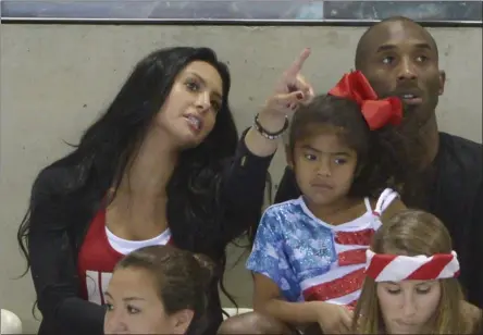  ?? MARK J. TERRILL - THE ASSOCIATED PRESS ?? FILE - In this Aug. 4, 2012 file photo Kobe Bryant with his wife Vanessa and daughter Gianna prepare to watch the final night of swimming at the Aquatics Centre in the Olympic Park during the 2012 Summer Olympics in London. Vanessa Bryant expressed grief and anger in an Instagram post Monday, Feb. 10, 2020, as she copes with the deaths of her husband Kobe Bryant, their daughter Gigi and seven other people in a helicopter crash last month.