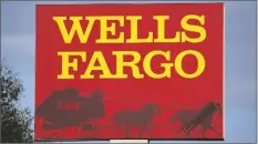  ?? GENE J. PUSKAR/AP ?? A WELLS FARGO SIGN stands in front of a branch of the bank in Bradenton, Fla., on Feb. 22.