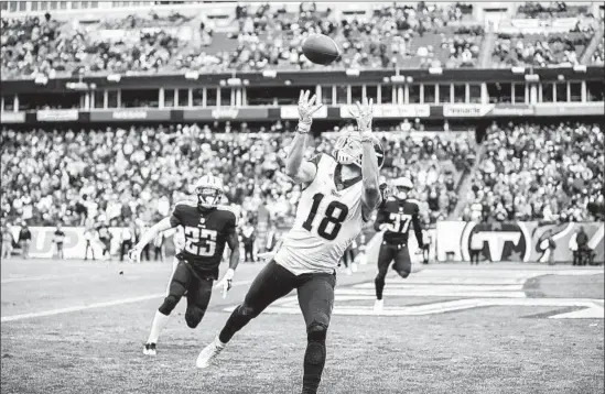  ?? Wesley Hitt Getty Images ?? WIDE RECEIVER Cooper Kupp catches a pass from Jared Goff for a 14-yard touchdown in the fourth quarter. The play put the Rams ahead of the Titans to stay.