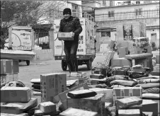  ?? SUNZHEN / FOR CHINA DAILY ?? A courier from a delivery company in Tianshui, Gansu province distribute­s express parcels.