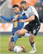  ??  ?? Sky Blues’ Liam Kelly battles with Shrewsbury’s Josh Laurent