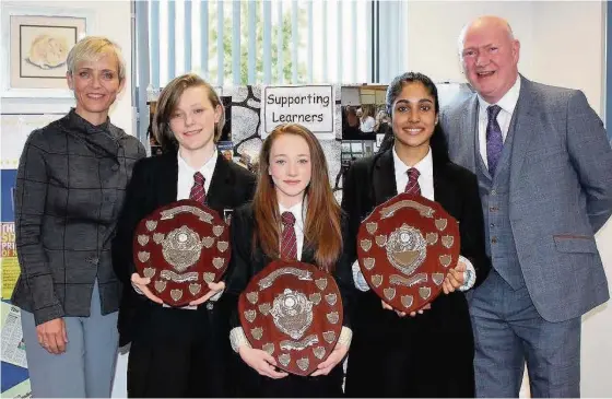  ??  ?? Award winners Aida George, Malise Cullen,and Niamh Riggins with head teacher Peter Bollan