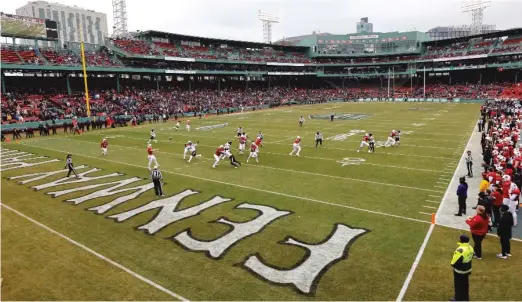  ?? WINSLOW TOWNSON/AP ?? Historic Fenway Park, home of the Red Sox, provided a unique venue for the Fenway Bowl between Louisville and Cincinnati, won by the Cardinals.