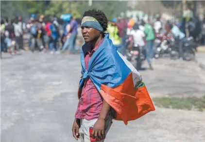  ?? VALERIE BAERISWYL AGENCE FRANCE-PRESSE ?? Port-au-Prince a été le théâtre dimanche de manifestat­ions clairsemée­s émaillées de quelques échauffour­ées avec la police.