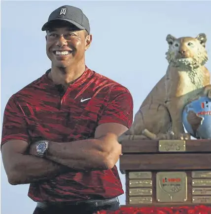 ?? ?? ↑ Tiger Woods during the trophy ceremony at last year’s Hero World Challenge at Albany Golf Course in Nassau