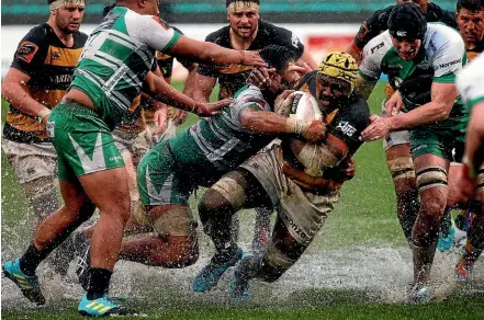  ?? PHOTOS: WILLIAM BOOTH/GETTY IMAGES ?? Taranaki’s Pita Gus Sowakula in the thick of the action. The loose forward was named player of the match.