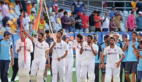  ?? (AFP) ?? Indian players celebrate their Test and series win over Australia at the end of the fourth Test at The Gabba in Brisbane on Tuesday