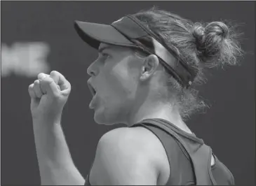  ?? The Associated Press ?? AMERICAN MADE: American Jennifer Brady celebrates winning a point against Russia’s Elena Vesnina during the third round of the Australian Open today in Melbourne. Qualifying for her first Grand Slam event, Brady won 7-6 (4), 6-2 over the 14th-seeded...