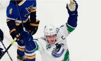 ?? Jeff Vinnick/Getty Images ?? Vancouver Canucks captain Bo Horvat scored the overtime winner to give Vancouver a 20 best-of-seven series lead over the St. Louis Blues Friday at Rogers Place in Edmonton, Alberta.