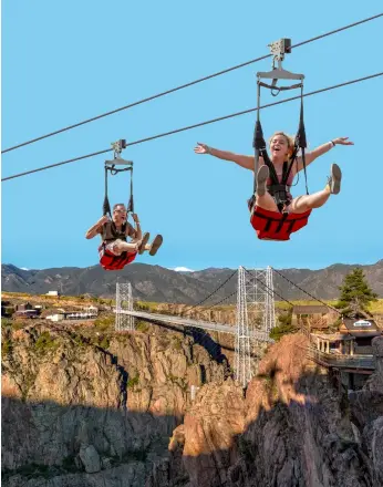  ?? PHOTOS: © MARLENE GOLDMAN, © CAGEDIVER .COM, © ANDREAS MANN | DREAMSTIME.COM, © ROYAL GORGE BRIDGE & PARK ?? Delight and Excite: (Left to right) Raft plunging into Overtime in Uganda; cage diving with great white shark in Guadalupe, Mexico; enjoying the view of Jungfrau, Switzerlan­d; and Cloudscape zip line at Colorado’s Royal Gorge Bridge & Park