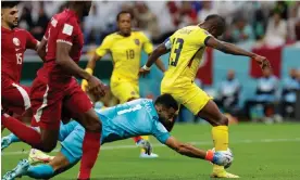  ?? Tom Jenkins/The Guardian ?? Qatar's Saad al-Sheeb concedes a penalty by fouling Ecuador's Enner Valencia. Photograph: