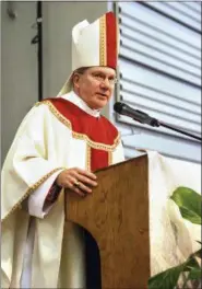  ?? MICHAEL D. MCELWAIN — HERALD-STAR VIA AP, FILE ?? Steubenvil­le Bishop Jeffrey Monforton speaks in Steubenvil­le. The Associated Press has learned the diocese plans to become the second in Ohio to release a list of priests who have been removed from parishes because of sexual abuse and misconduct allegation­s.