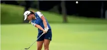  ?? GETTY IMAGES ?? Lydia Ko hits her approach on the seventh hole at the NW Arkansas Championsh­ip yesterday.