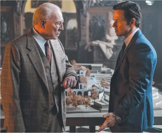  ??  ?? Christophe­r Plummer as J Paul Getty and Mark Wahlberg as Fletcher Chase in a scene from film All the Money in the World