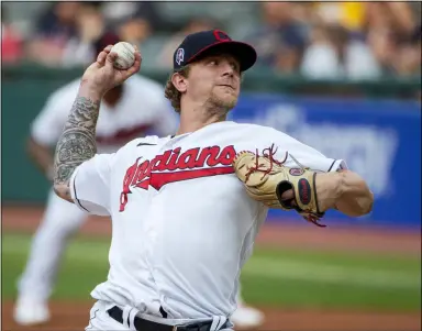  ?? PHIL LONG — THE ASSOCIATED PRESS ?? Indians starting pitcher Zach Plesac delivers against the Brewers during the first inning in Cleveland, Sept. 11.