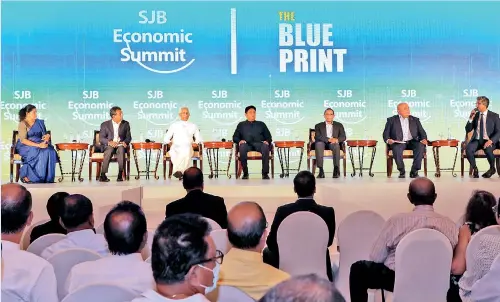  ?? ?? Launching the blueprint for economic recovery at the SJB economic summit on Tuesday. Pic by M.A. Pushpa Kumara