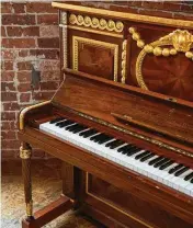  ?? JO RITCHIE/THE NEW YORK TIMES ?? A Steinway & Sons walnut upright piano that was commission­ed in 1912 for the ocean liner Olympic, the sister ship of the Titanic, at the showroom of Besbrode Pianos in Leeds, England.