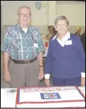  ??  ?? Above right: Mitchell Green, left, Amissville Volunteer Fire and Rescue's only surviving charter member from 1952, and Sarah Latham (who with Jack Atkins was honored for 50 years of service to Company 3), prepare to cut the department's...