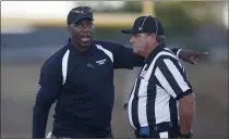  ?? NHAT V. MEYER — BAY AREA NEWS GROUP FILE ?? South head coach Ajene Palmer talks to a referee during their game against the North in the second quarter of the 45th annual Charlie Wedemeyer High School All-Star Football Game at Westmont High School in Campbell on July 18, 2019.