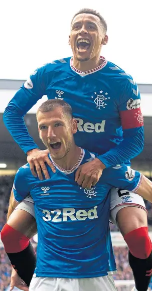  ??  ?? Rangers captain James Tavernier and Borna Barisic celebrate at Ibrox.