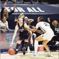  ?? Gary Landers / Associated Press ?? UConn guard Paige Bueckers (5) drives against Xavier forward A’Riana Gray (21) during the first half on Saturday.