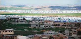  ?? AFPPIX ?? The Hasan Sham camp for internally displaced Iraqis 30km east of Mosul. The unpreceden­ted destructio­n in the country’s second city and the unstable security situation will delay the return of hundreds of thousands of people to their homes.