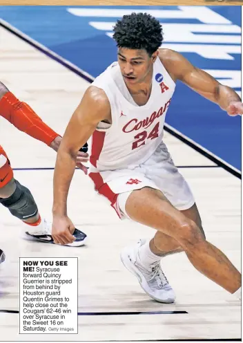  ?? Getty Images ?? NOW YOU SEE
ME! Syracuse forward Quincy Guerrier is stripped from behind by Houston guard Quentin Grimes to help close out the Cougars’ 62-46 win over Syracuse in the Sweet 16 on Saturday.