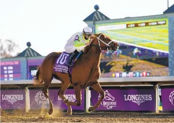  ?? MICHAEL CONROY AP ?? Florent Geroux rides Monomoy Girl to win the Breeders’ Cup Distaff. She won the same race in 2018.