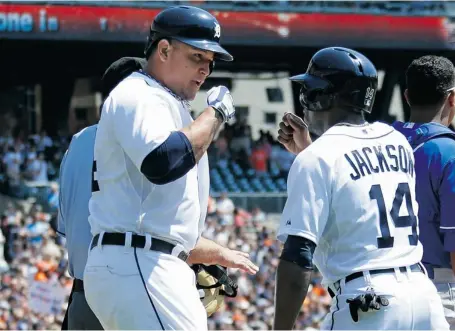  ?? GREGORY SHAMUS/GETTY IMAGES ?? Miguel Cabrera of the Detroit Tigers, left, shown celebratin­g a home run against the Kansas City Royals on Sunday with teammate Austin Jackson, has been producing unpreceden­ted offensive numbers.