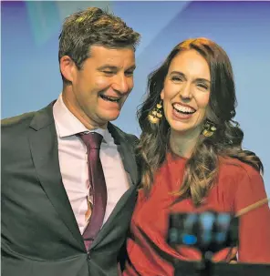  ??  ?? Jacinda Ardern is congratula­ted by her partner Clarke Gayford after she won a second term as New Zealand Prime Minister last year.