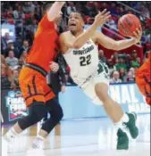  ?? PAUL SANCYA — THE ASSOCIATED PRESS ?? Michigan State guard Miles Bridges drives on Bucknell forward Zach Thomas on March 16 during the NCAA tournament in Detroit. Bridges could be an interestin­g pick for the Cavs at No. 8.