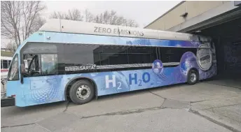  ??  ?? Kevin Baker drives a hydrogen fuel cell bus out of a terminal in Canton, Ohio, in March.