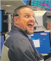  ?? SPENCER PLATT/GETTY IMAGES ?? A trader on the floor of the New York Stock Exchange on Tuesday. Major indexes are still broadly lower for October.