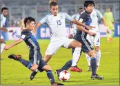  ?? PTI ?? England defender Joel Latibeaudi­ere(15) and Toichi Suzuki(18), midfielder of Japan vie for the ball.