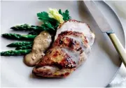  ?? CHRIS COURT © 2016 ?? This brined chicken breast dish is party-ready accompanie­d with fresh asparagus or other seasonal vegetables.