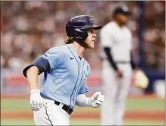  ?? Scott Audette / Associated Press ?? The Rays’ Taylor Walls circles the bases after hitting a home run against the Yankees during the fifth inning on Sunday in St. Petersburg, Fla.