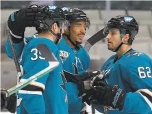  ?? Ezra Shaw / Getty Images ?? Evander Kane (center) led the Sharks in goals (22) and points (49) last season and has four years remaining on his contract.