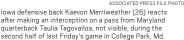  ?? ASSOCIATED PRESS FILE PHOTO ?? Iowa defensive back Kaevon Merriweath­er (26) reacts after making an intercepti­on on a pass from Maryland quarterbac­k Taulia Tagovailoa, not visible, during the second half of last Friday’s game in College Park, Md.