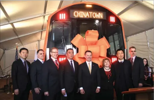  ?? HONG XIAO / CHINA DAILY ?? Jia Bo (left), vice-president of CRRC MA; Zhou Chuanhe (fourth from left), president of CRRC MA; Brian Shortsleev­e (fourth from right), chief administra­tor and acting general manager of MBTA; Stephanie Pollack (third from right), secretary and CEO of...