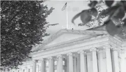  ?? PATRICK SEMANSKY/AP ?? The new law seeks to strengthen the tools used by the Treasury Department to track shell companies. Above, the Treasury Department building in Washington.