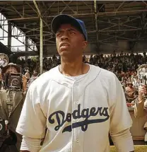  ?? Courtesy of Warner Bros. Pictures ?? Chadwick Boseman stars as Jackie Robinson, the first Black athlete to play in Major League Baseball, in “42.”