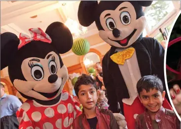  ??  ?? Aarav and Kanav Sukhija with Minnie Mouse and Mickey Mouse.