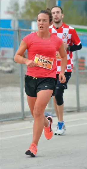  ??  ?? BELOW Fraumeni racing the Scotiabank Toronto Waterfront Marathon 2014